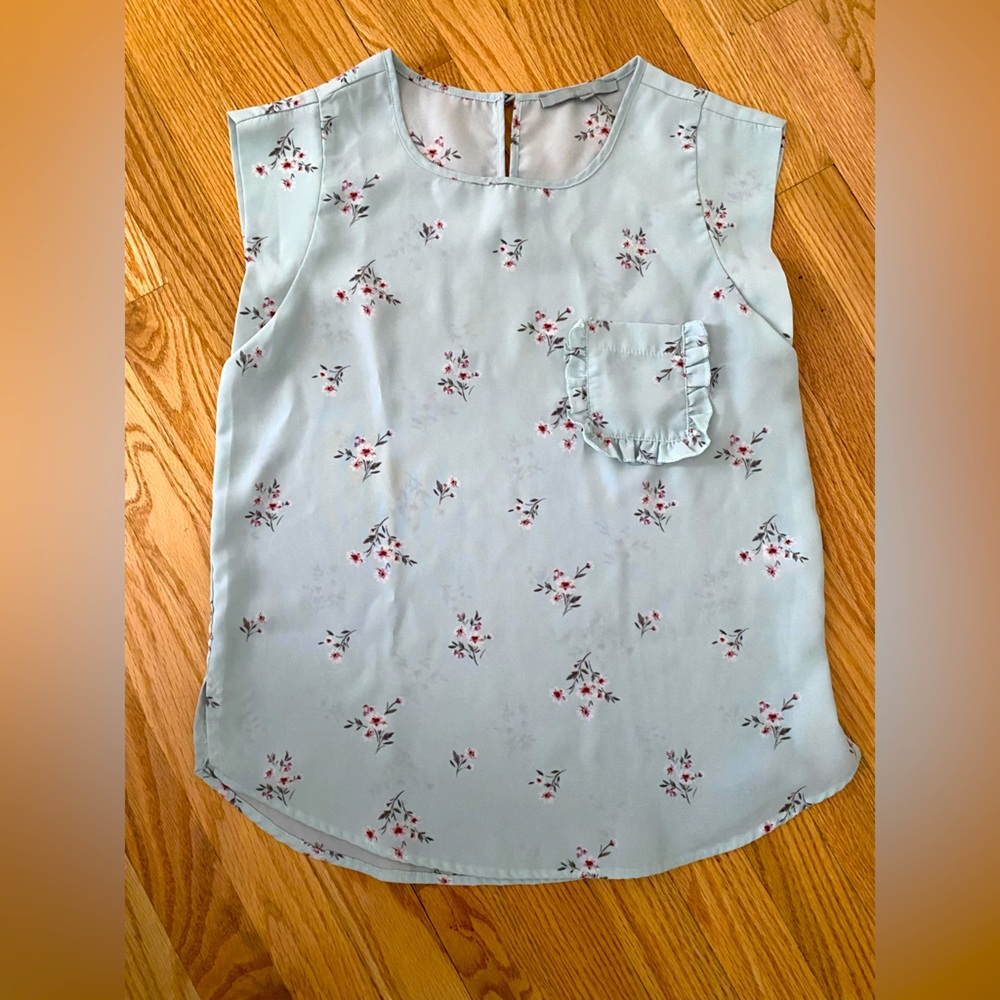 Light blue blouse with flowers.